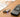 Hearing aid next to HAC compatible flip phone on table