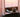 Kosher flip phone on quiet windowsill at sunrise — Pom Classic distraction-free phone