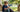 Child using an open flip phone on porch steps — safe first phone for kids