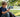 Child using an open flip phone on porch steps — safe first phone for kids